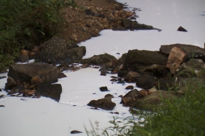 A video still of a creek in Smyrna, Georgia that was contaminated in 2016 by a chemical spill.
