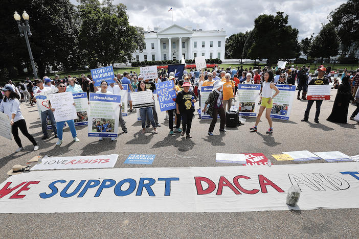 In this Sunday, Sept. 3, 2017 photo, supporters of Deferred Action for Childhood Arrivals program (DACA), demonstrate on Pennsylvania Avenue in front of the White House in Washington. 