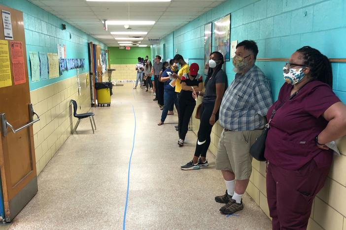 Voters line up at a polling location Tuesday, June 9, 2020, in DeKalb County.
