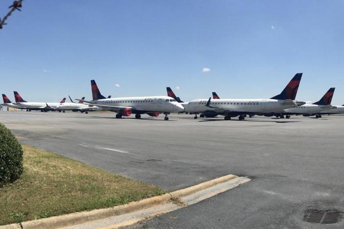 More than a dozen Delta Connection jets from Republic and Compass airlines are parked at Middle Georgia Regional Airport during the COVID-19 pandemic.