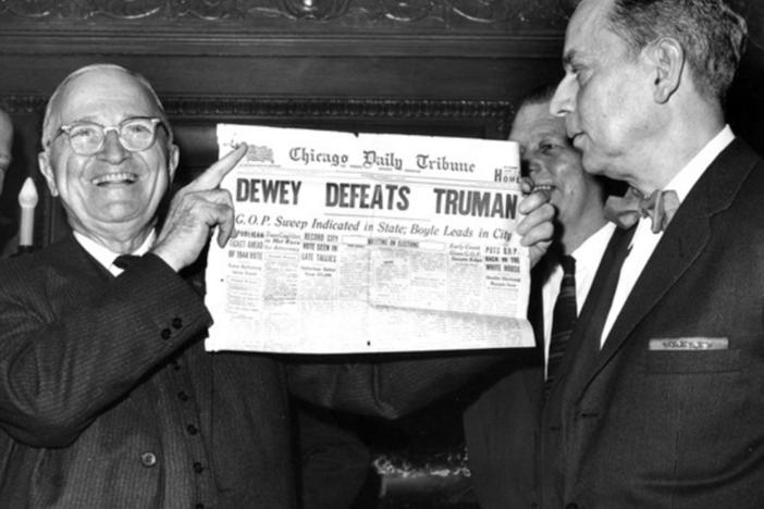 A smiling President Harry S. Truman (left) holds a copy of the famous Chicago Daily Tribune paper declaring "Dewey Defeats Truman." Truman, in fact, defeated Dewey, but the Tribune sent its paper to press before the final results came in.