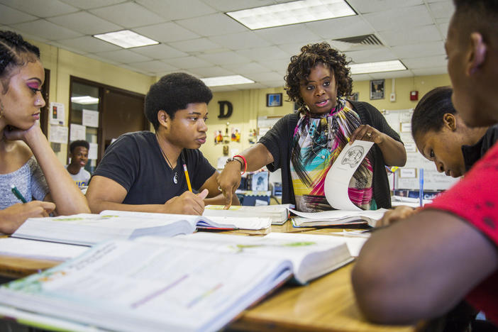 Chiquita Dinkins teaches a unit on photosynthesis to students at Northeast High School in Macon. Dinkins, who was head cheerleader at Northeast as a student in the 1980s, is one of 18 alumni teachers at the school. 
