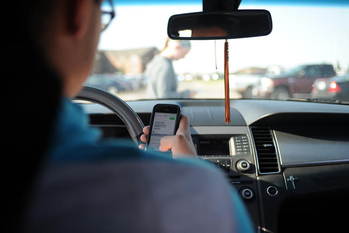 Distracted driving citations have spiked in the first year of Georgia's distracted driving law. 