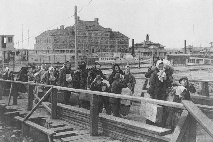 Immigrants arriving at Ellis Island in 1902. 