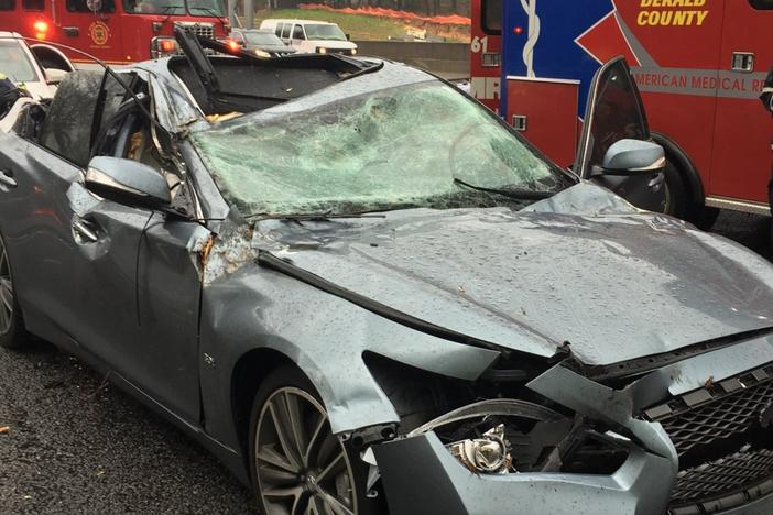 A tree hit a car on I-285 in Dunwoody Thursday morning during severe weather. 