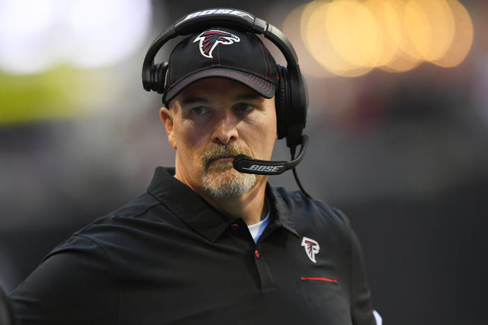 Atlanta Falcons head coach Dan Quinn stands on the sidelines during the first half of an NFL football game against the Seattle Seahawks, Sunday, Oct. 27, 2019, in Atlanta.