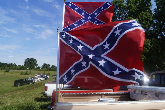 Two Confederate flags fly at Nash Farm Battelfield Park during a rally in support of the flag.