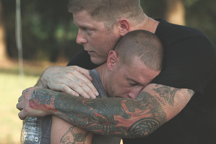 Chris Buckley (left) of the Grand Knighthawk for the North Georgia White Knights and peace activist Arno Michaelis (right) in a scene from the now canceled A&E series,  Escaping the KKK: A Documentary Series Exposing Hate in America. 