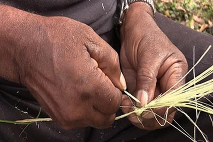 Sapelo Island resident makes a traditional Gullah basket.