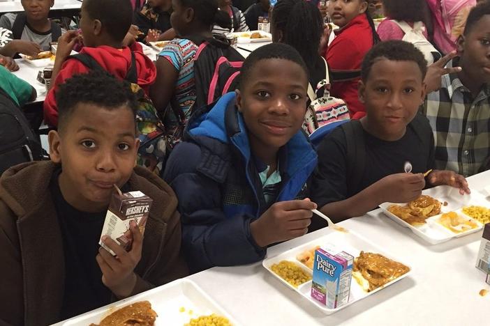 Children eat at the Reconstructing Youth Foundation in Tyrone, Georgia. 