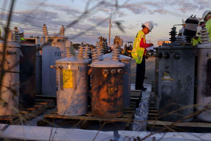 Electrical workers were up before dawn readying transformers and power poles to get the thousands of people in and around Albany back on the electrical grid.