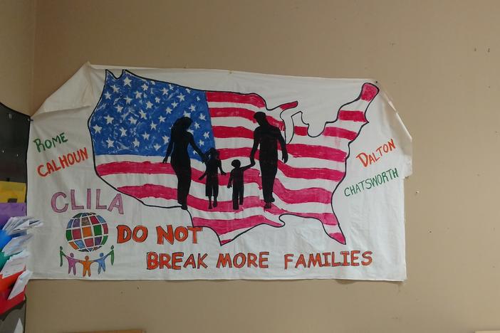 A sign hangs up in the offices of Coalicion de Lideres Latinos in Dalton, Georgia. The group provides support for immigrants in the area.