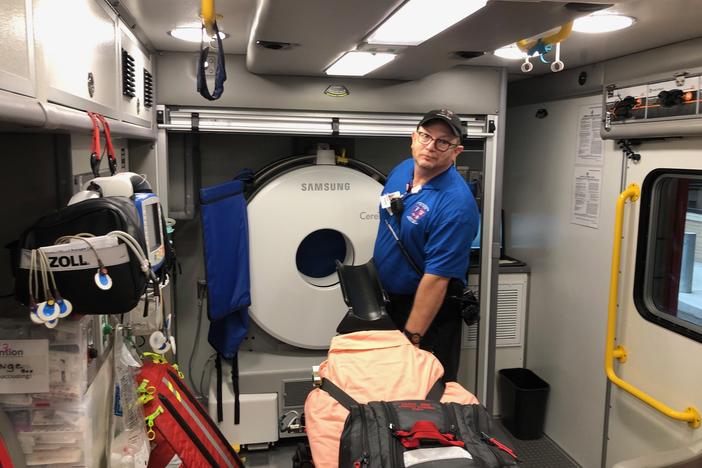 Grady Bagley adjusts the stretcher in the mobile stroke ambulance that runs at Grady Memorial Hospital as part of the Marcus Stroke and Neuroscience Center. 