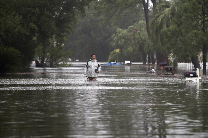 Joey Spalding walks back to his truck down the street where he lives, Monday, Sept. 11, 2017, on Tybee Island, Ga. He said the Tropical Storm Irma brought three feet of storm surge into his living room today.