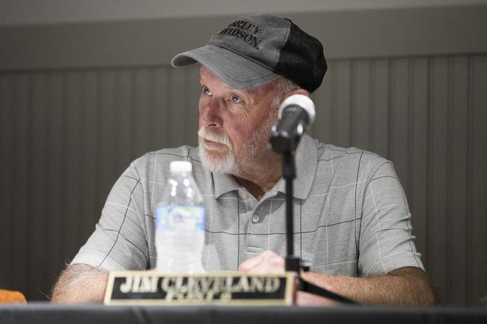 Hoschton City Councilman Jim Cleveland listens during a city council meeting at the Hoschton Historic Train Depot in Hoschton, Ga., Monday, May 6, 2019.