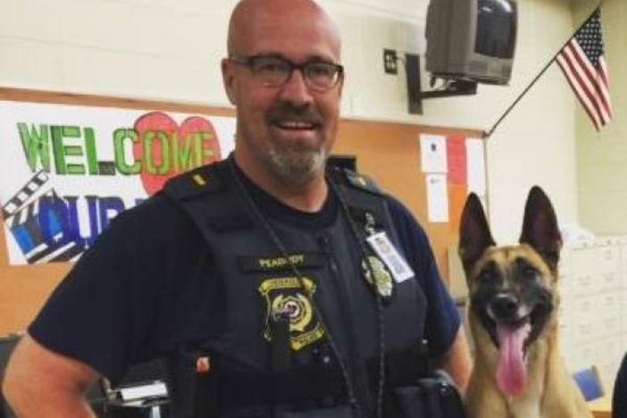 Former Cherokee County School police officer Lt. Dan Peabody and his police K-9 named Inka, who died from heat exhaustion after being left inside a police cruiser.