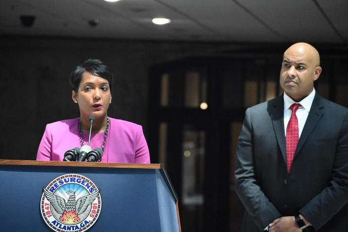 Atlanta Mayor Keisha Lance Bottoms and Chief Operating Officer Richard Cox stand at Atlanta City Hall during a press conference about transparency.