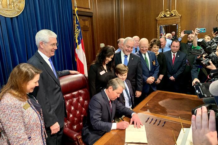 Gov. Brian Kemp signs his first law Friday, Feb. 15.