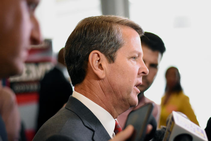 Republican gubernatorial nominee Brian Kemp speaks to reporters at his Atlanta campaign headquarters.