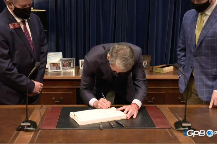 Gov. Brian Kemp signs the FY21 budget.