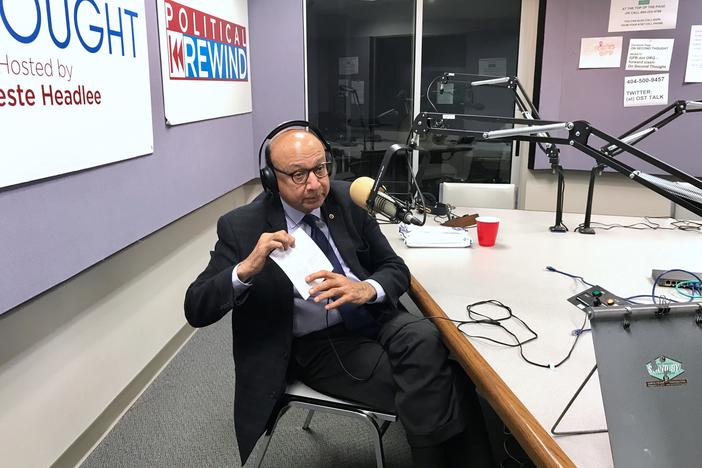 Khizr Khan at the GPB studios, holding his pocket copy of the U.S. Constitution.