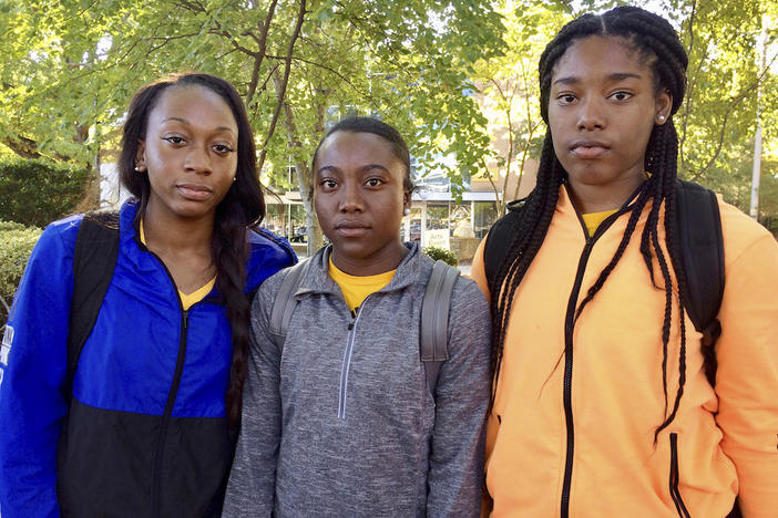 KSU cheerleaders, from left to right, Shlondra Young, Tommia Dean and Kennedy Town are part of a group of cheerleaders that say they'll take a knee in the stadium tunnel when the national anthem is played at Saturday's homecoming game.