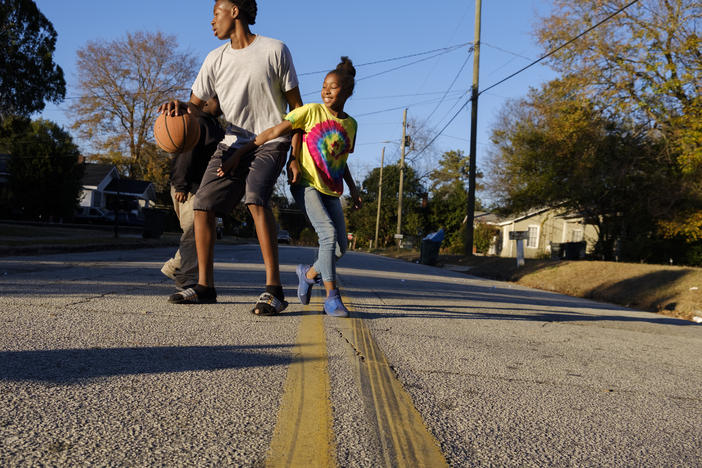 Children play on a side street in the Macon neighborhood with the lowest life expectancy in Georgia, 63 years. The neighborhood has over 11 percent unemployment and a median income of under $20,000 a year. 