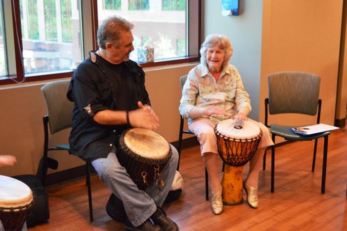 Cancer patient Liz Jones with drumming instructor Pete