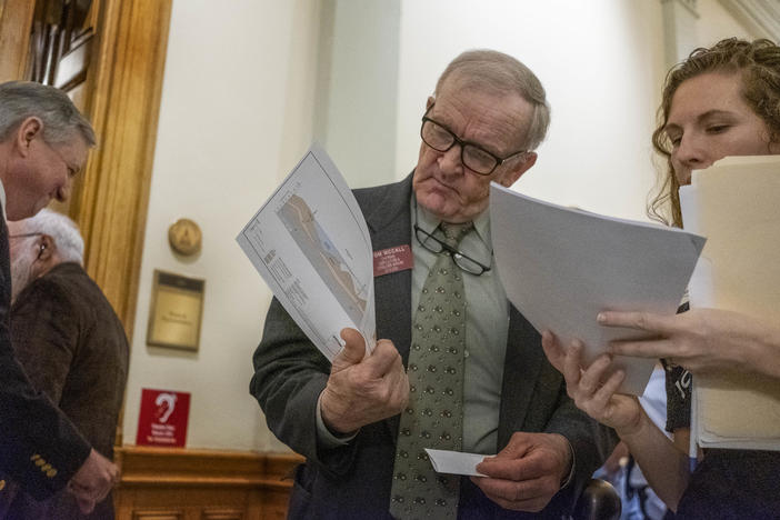 Amber Joyner (R) talks with Tom McCall (R-Elberton) during a lobbying day at the Capitol by the people of Juliette in Monroe County. 