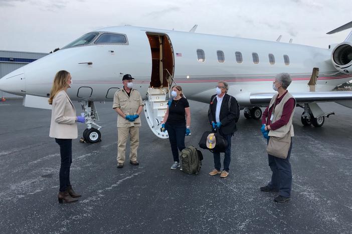 Sen. Kelly Loeffler greets four Georgians that were stranded on a cruise ship off the coast of Florida because of coronavirus.