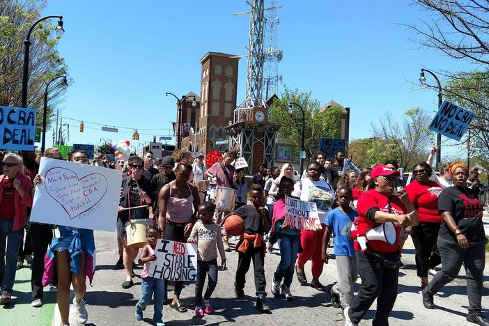 The Turner Field Community Benefits Coalition demonstrates on Saturday, April 1, 2017. The group worries the future development of Turner Field will lead to gentrification  in surrounding neighborhoods.