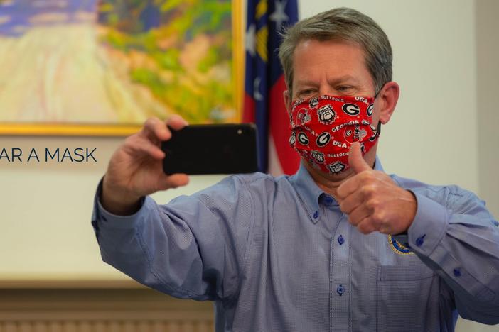 Gov. Brian Kemp shared a photo to Twitter of himself in a cloth face mask Monday, June 29, 2020.