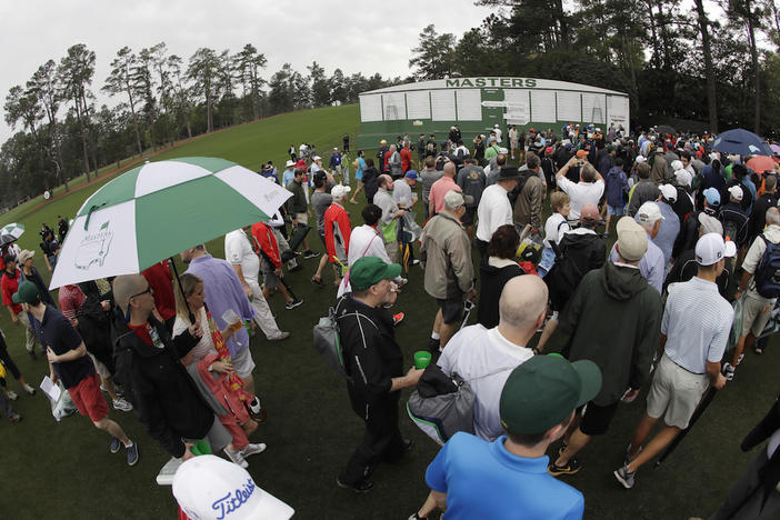 Fans leave Augusta National for a weather warning during a practice round for the Masters golf tournament Wednesday, April 5, 2017, in Augusta, Ga. 