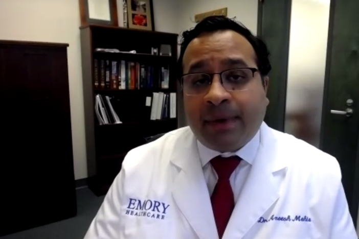 Dr. Aneesh Mehta, associate professor in the division of infectious diseases at Emory University School of Medicine updates press during a Zoom conference April 29, 2020.