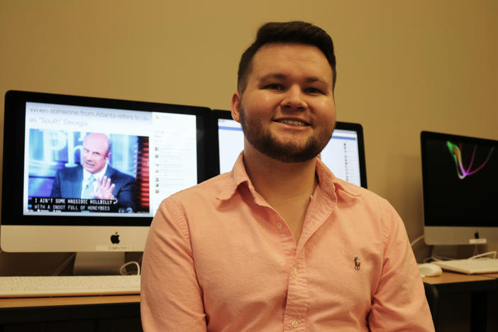 Macon native Miles Mashburn sits at a computer, ready to work on his popular Macon Memes Facebook page.