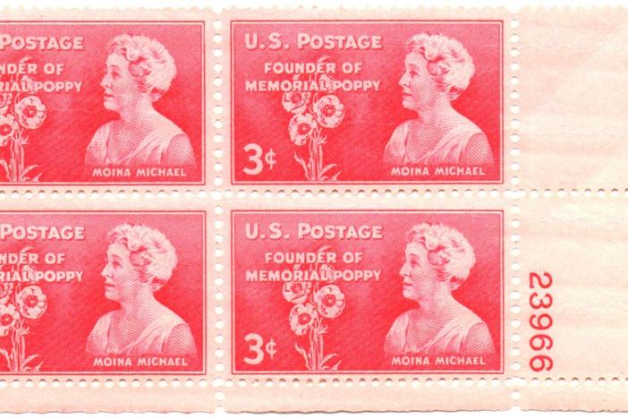 A commemorative stamp featuring Moina Michael, who brought the red poppy to the spotlight as a symbol of remembrance for those who died during war.