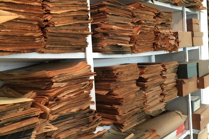 Stacks of old newsprint line the walls of the Georgia Weekly Newspaper Musuem in Homer.