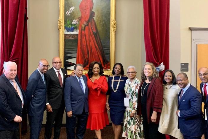 Winfrey poses in front of a painting of her likeness. The portrait was unveiled on Monday at Morehouse College in Atlanta