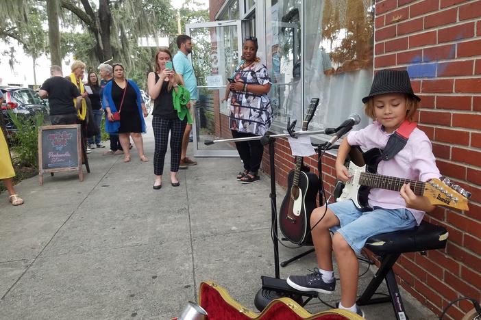Guitarist Oz Yakabovits, 8, plays a set outside a gallery show by Savannah artist Panhandle Slim.