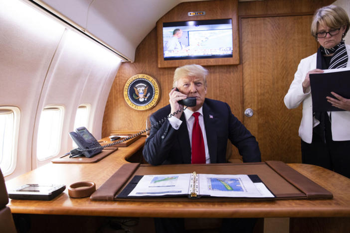 President Donald J. Trump aboard Air Force One as he talks on the phone with Georgia Gov. Nathan Deal about the latest impact update on Hurricane Matthew.