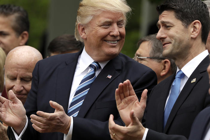 In this May 4, 2017, photo, President Donald Trump talks to House Speaker Paul Ryan of Wis. in the Rose Garden of the White House in Washington, after the House pushed through a health care bill.