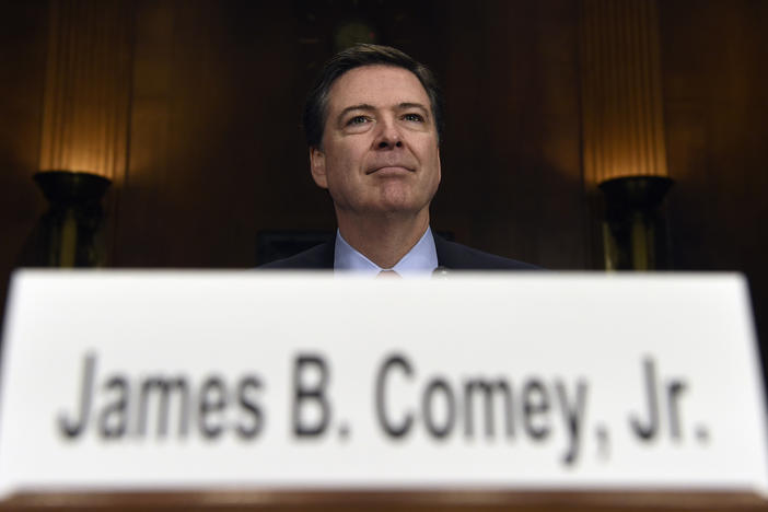 In this Dec. 9, 2015 file photo, FBI Director James Comey prepares to testify on Capitol Hill in Washington. Comey announced last week that the FBI is reviewing new emails possibly relevant to Hillary Clinton's private email server investigation.