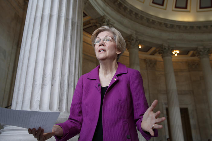 Holding a transcript of her speech in the Senate Chamber, Democratic Sen. Elizabeth Warren of Massachusetts reacts to being rebuked by the Senate leadership and accused of impugning a fellow senator, Wednesday, Feb. 8, 2017. 