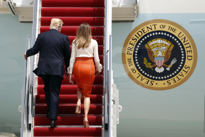 President Donald Trump, with first lady Melania Trump, board Air Force One at Andrews Air Force Base, Md., Friday, May 19, 2017, prior to his departure on his first overseas trip.