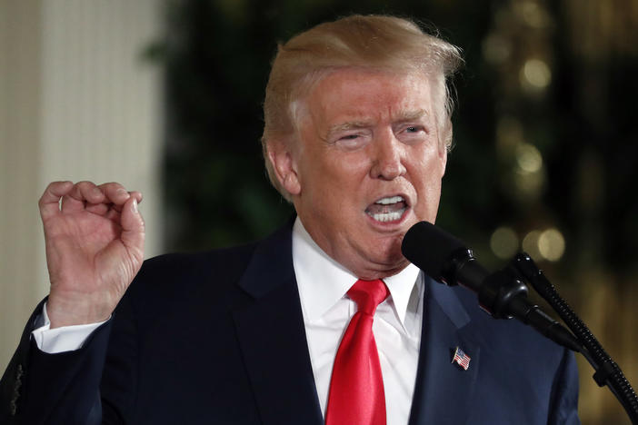 In this July 31, 2017, file photo, President Donald Trump in the East Room of the White House. Trump signed on Aug. 2, what he called a "seriously flawed" bill imposing new sanctions on Russia.