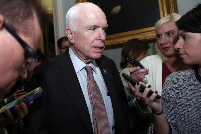 Sen. John McCain, R-Ariz., speaks with reporters before heading into a policy luncheon on Capitol Hill, Tuesday, Sept. 19, 2017, in Washington. 