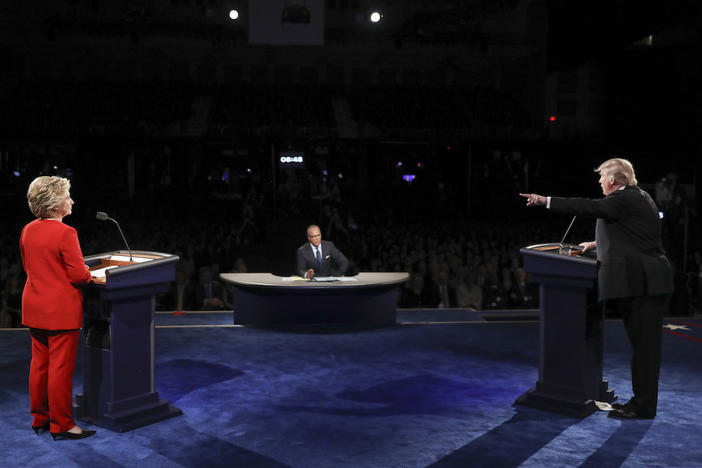 Republican presidential nominee Donald Trump points toward Democratic presidential nominee Hillary Clinton during the presidential debate at Hofstra University in Hempstead, N.Y., Monday, Sept. 26, 2016. 