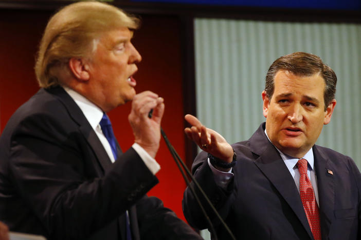 Republican presidential candidates, businessman Donald Trump and Sen. Ted Cruz, R-Texas, argue a point during a Republican presidential primary debate at Fox Theatre, Thursday, March 3, 2016, in Detroit. 