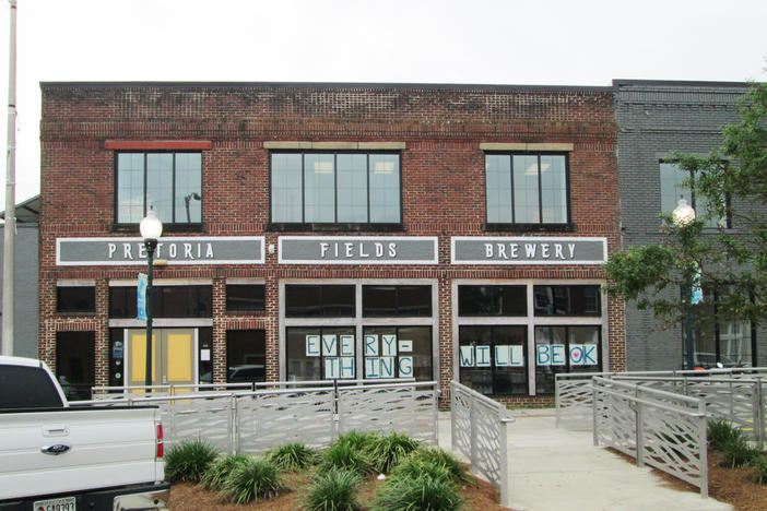 Signs in the windows of the Pretoria Fields Brewery in Albany aimed at reassuring residents coping with coronavirus. The brewery recently began making hand sanitizer. 