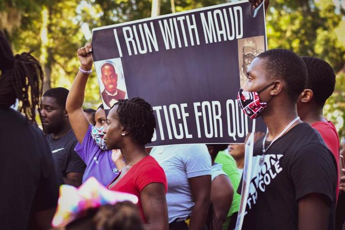 Protesters gathered evening to demand answers and action on the February shooting death of Ahmaud Arbery.